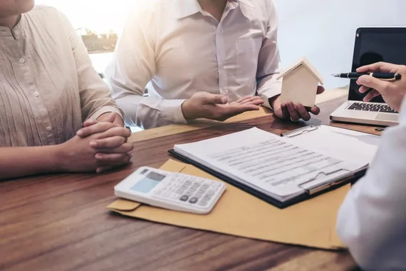 Borrowers going over the loan process for short term private money loans.