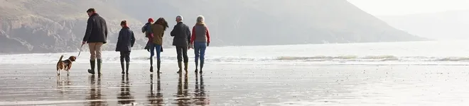 Family enjoying time at the coast knowing they have invested at Precision Capital.